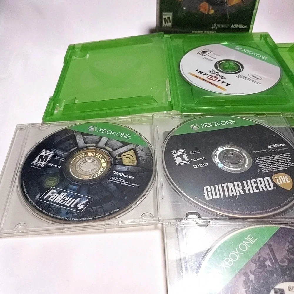 Microsoft Xbox One Video Game Lot Bundle 7 Discs COD Black Ops IV WWII Fallout 4